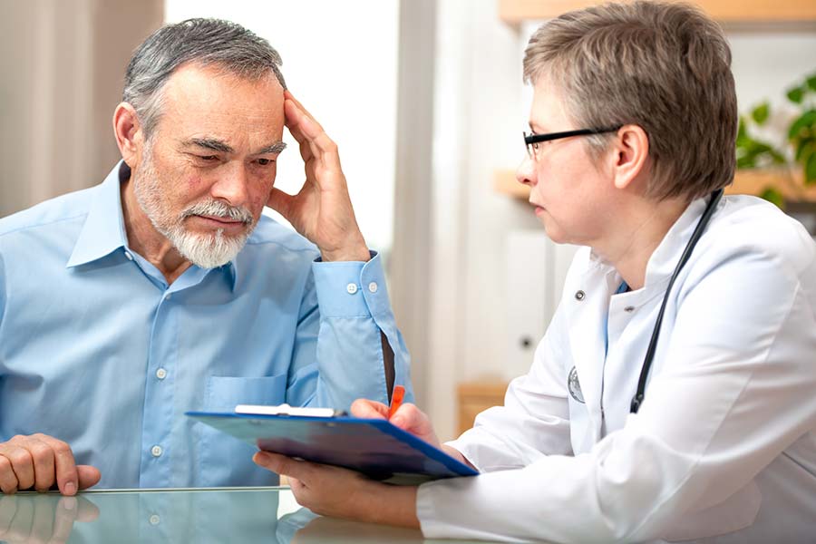 Middle-aged man speaking with his doctor